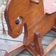 Rocking horse in raw and glazed wood
