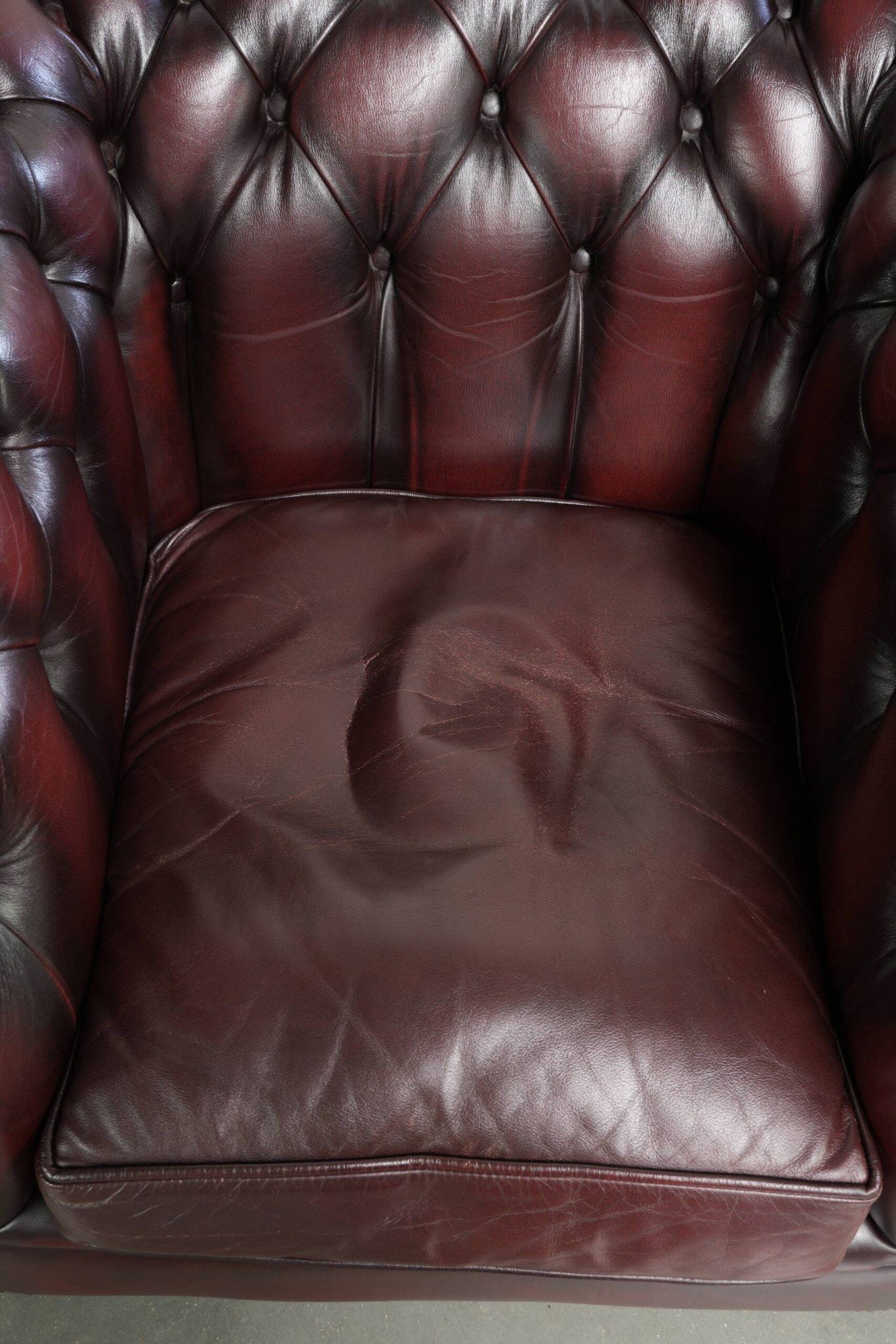 English cowhide Chesterfield club armchair in a beautiful red colour
