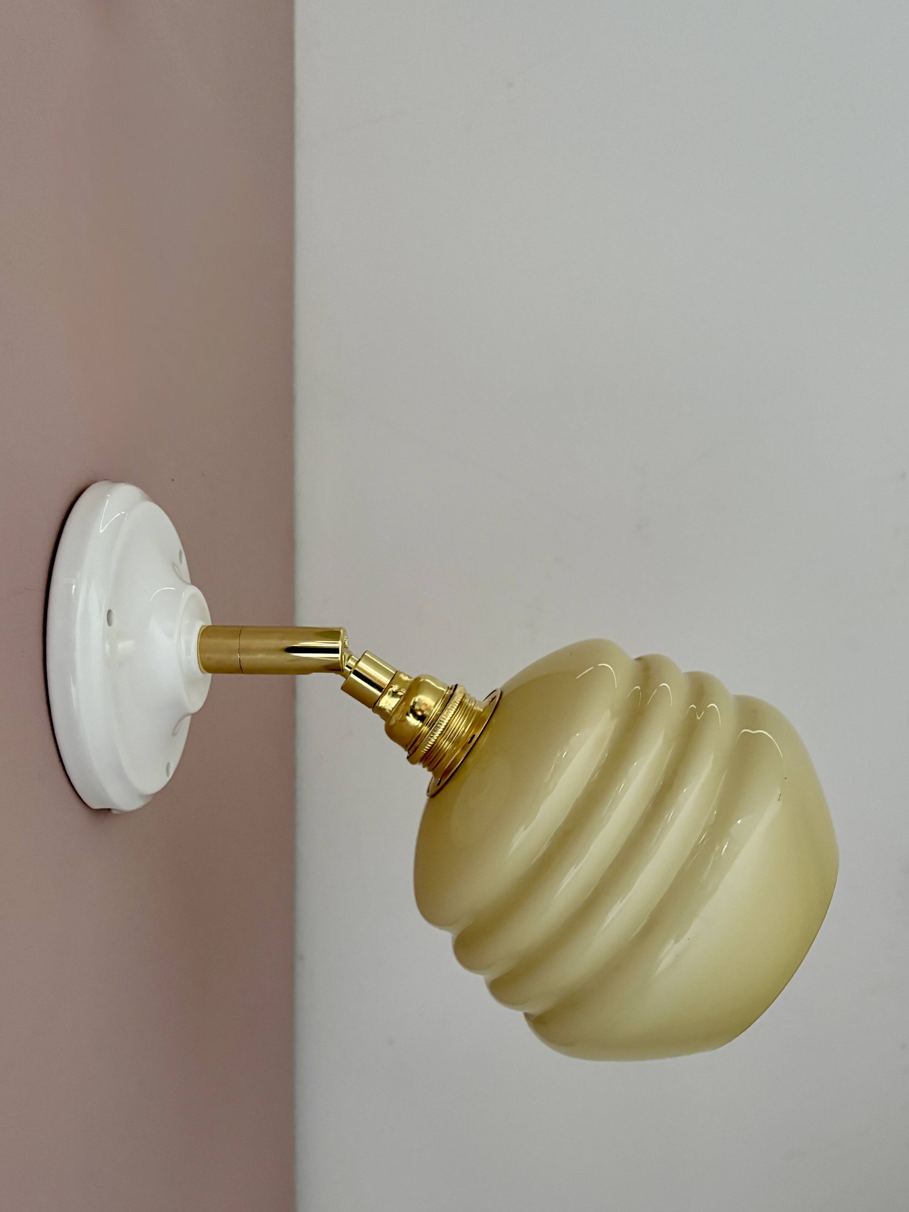 Vintage globe wall lamp in pale yellow opaline