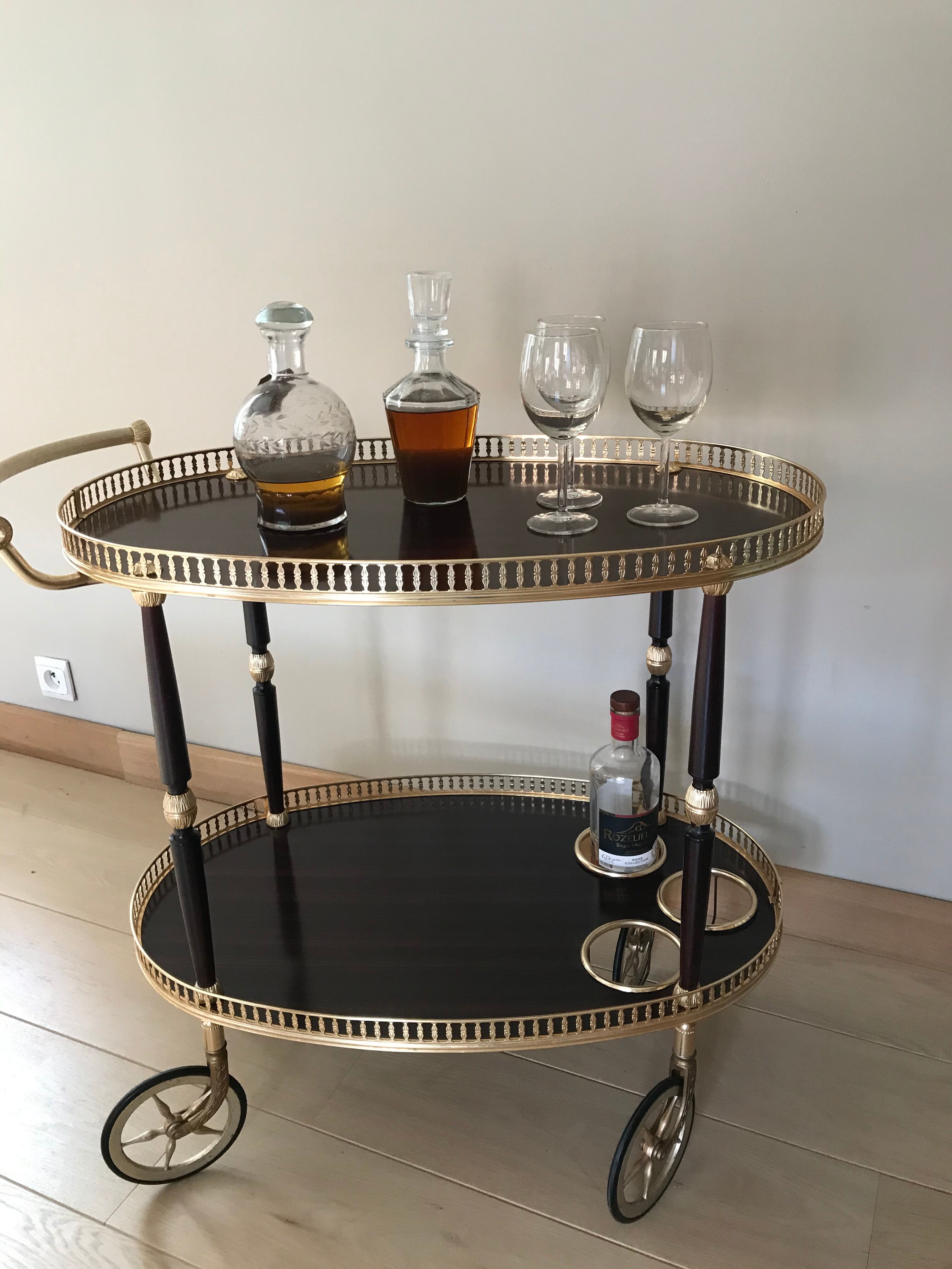 Golden wheeled serving trolley