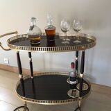 Golden wheeled serving trolley
