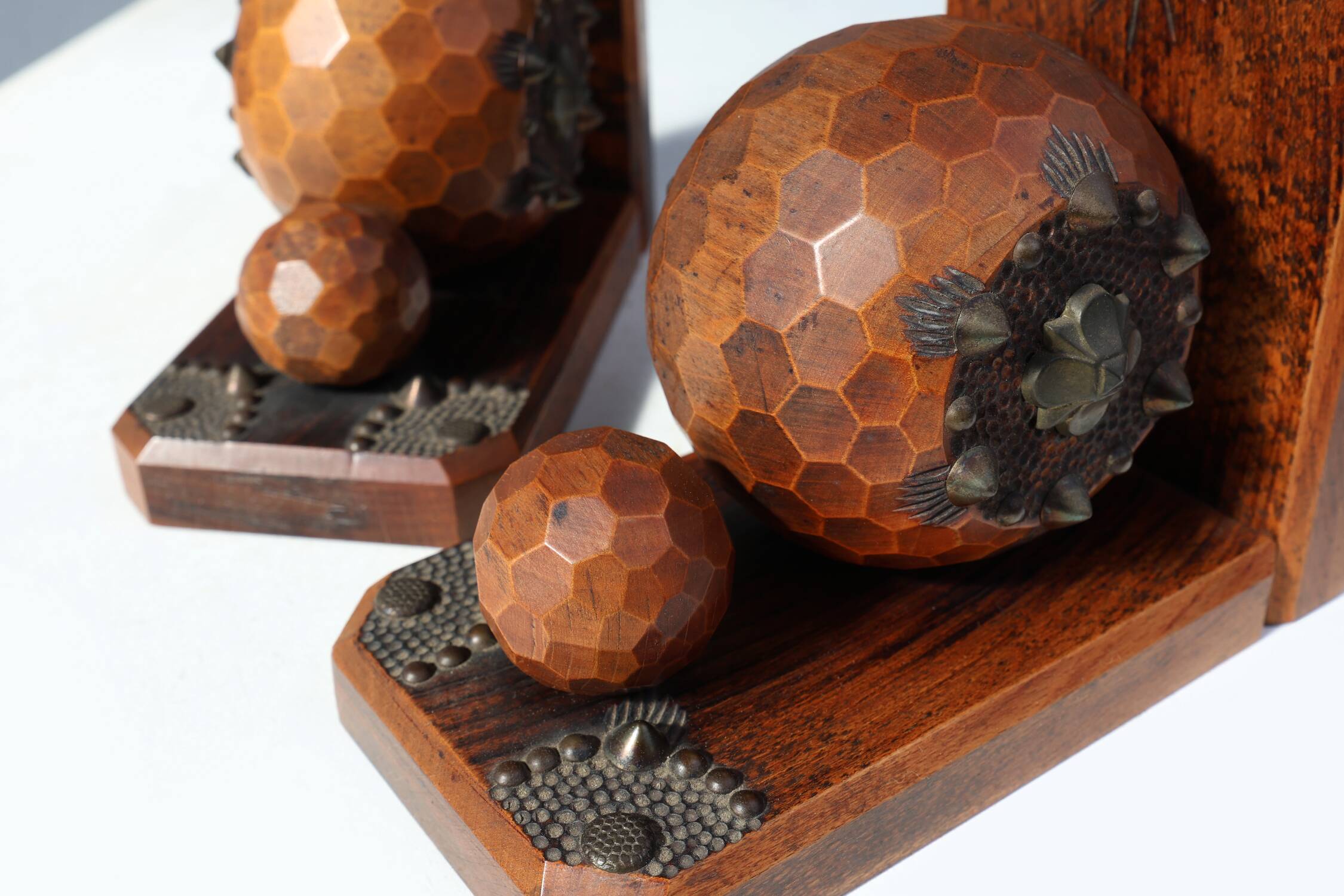 Pair of Art Deco faceted ball bookends in oak with metal decorations