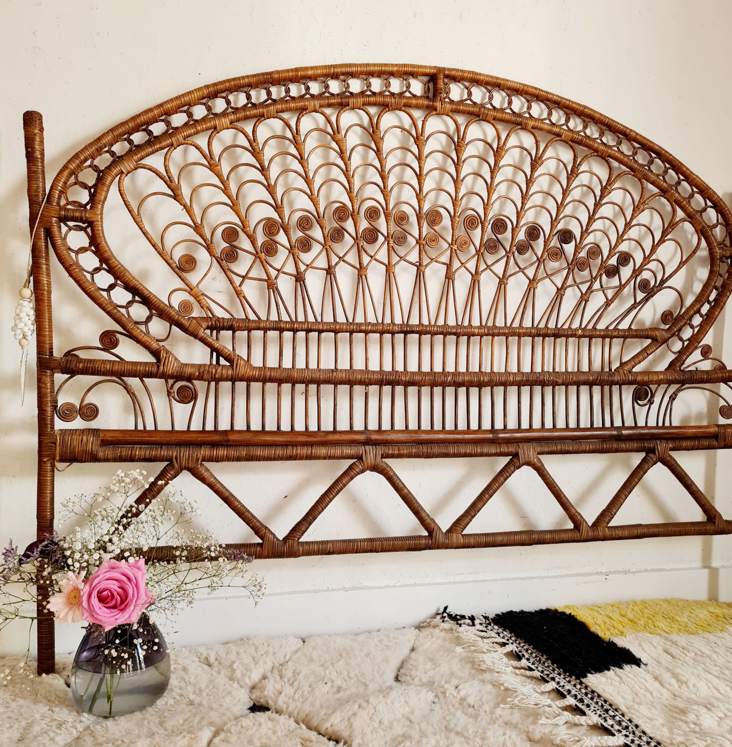 Peacock headboard in vintage rattan