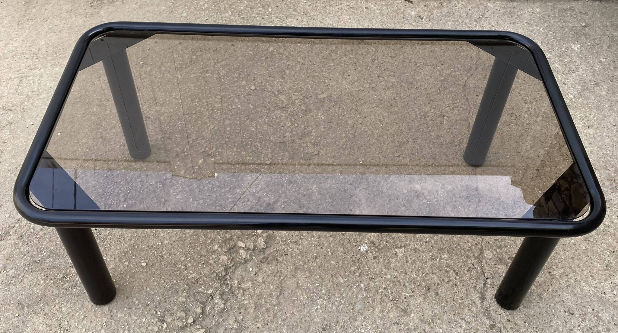 Vintage black tubular coffee table with smoked glass by Yves Boutboul, 1980.