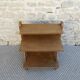 Light wood bedside table with crossbars and 3 shelves, around 1950.