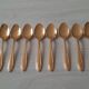 Small golden metal spoons
