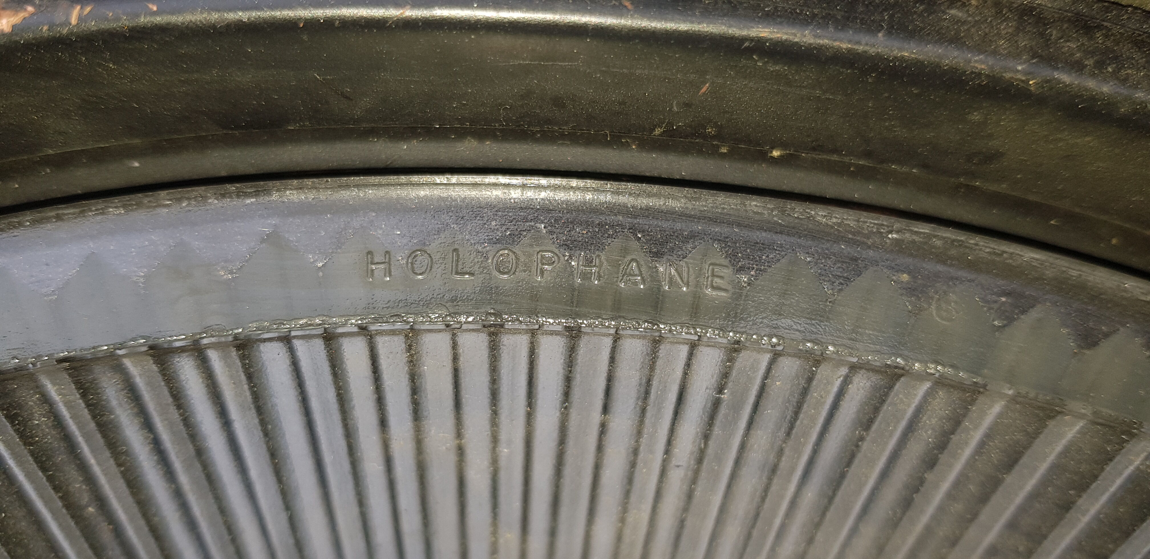 Old brass boat headlight with Holophane interior glass