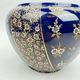 Limoges porcelain flowerpot with gold enamel decoration and blue relief flowers from Four