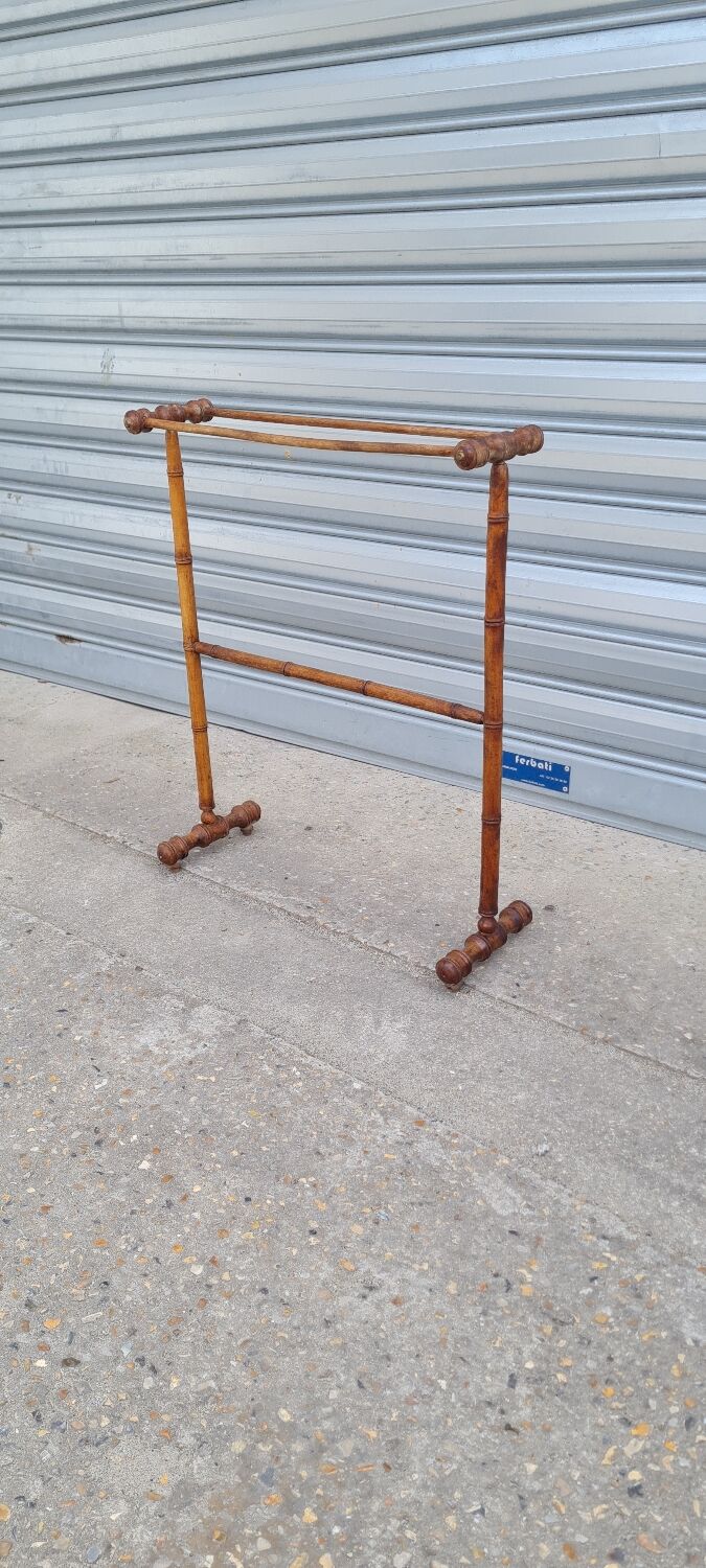 Turned wooden towel rack