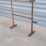 Turned wooden towel rack