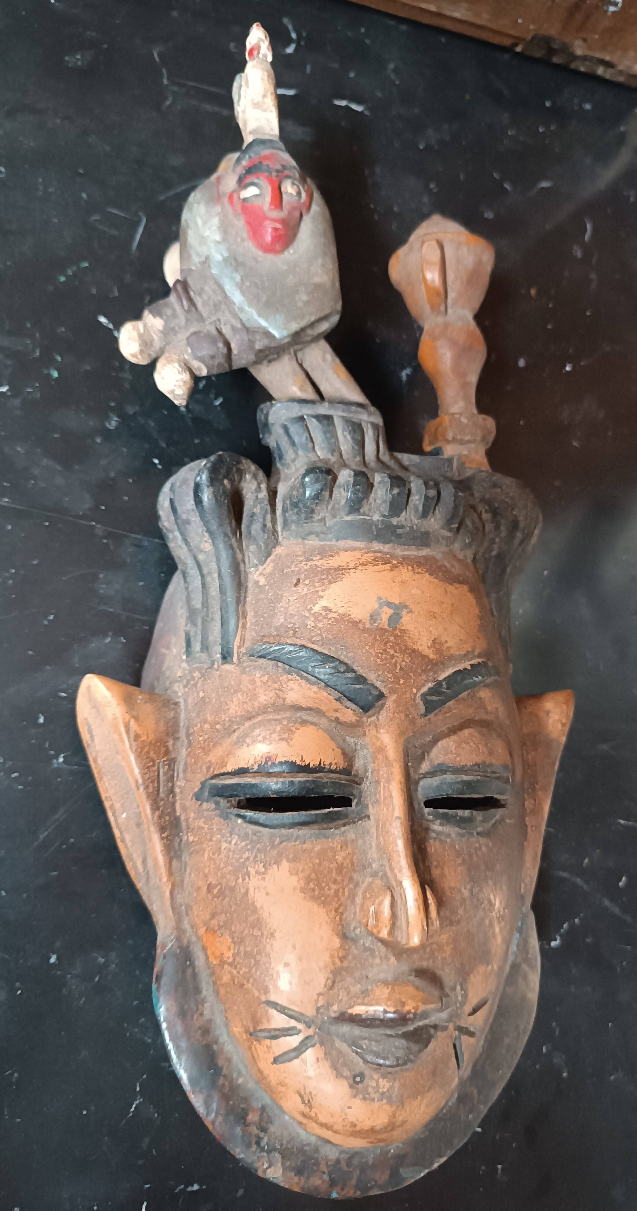 Old tribal ethnic mask in carved wood