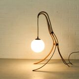 Sculptural table lamp with globe