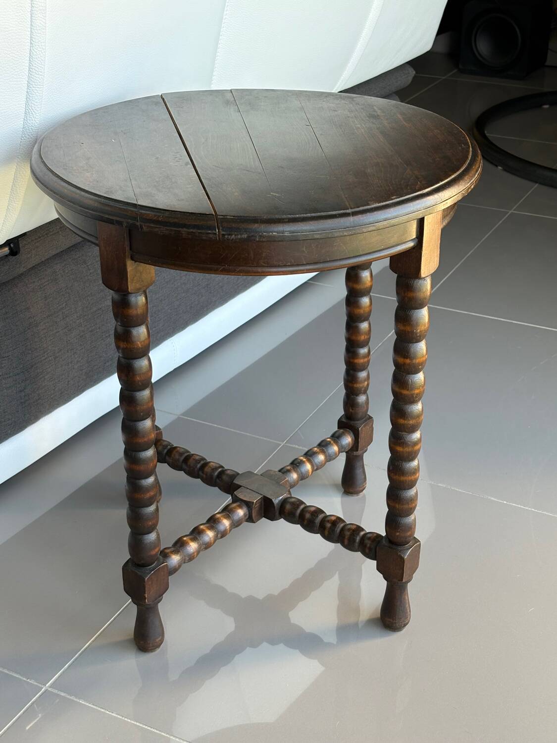 Antique turned wooden side table with authentic charm.