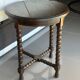 Antique turned wooden side table with authentic charm.