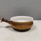 Small ceramic bowl with handle, in golden colours. Danish 1960-70s