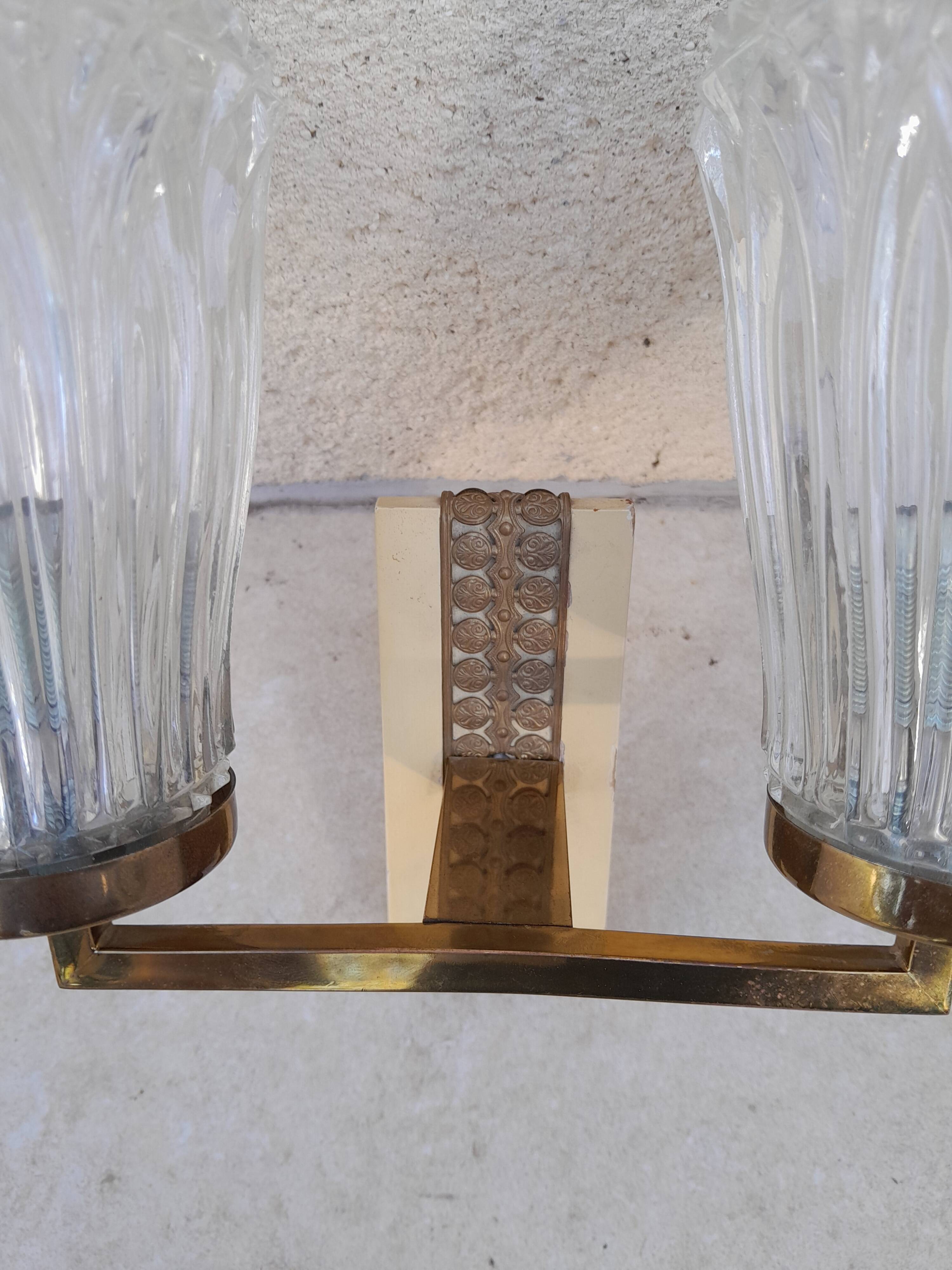 Pair of vintage wall lights from the 50s and 60s in brass glass