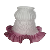 Antique tulip lampshade in transparent glass with a red rim.