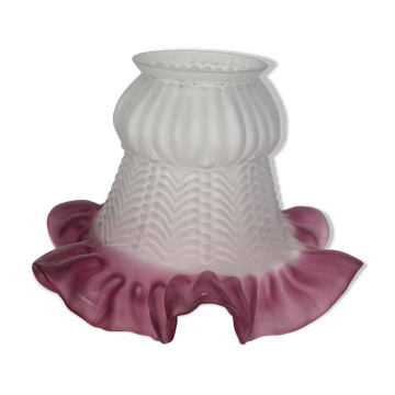 Antique tulip lampshade in transparent glass with a red rim.