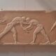 Bas-relief in the antique style featuring athletes.