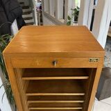 1950s oak office storage cabinet with curtains.