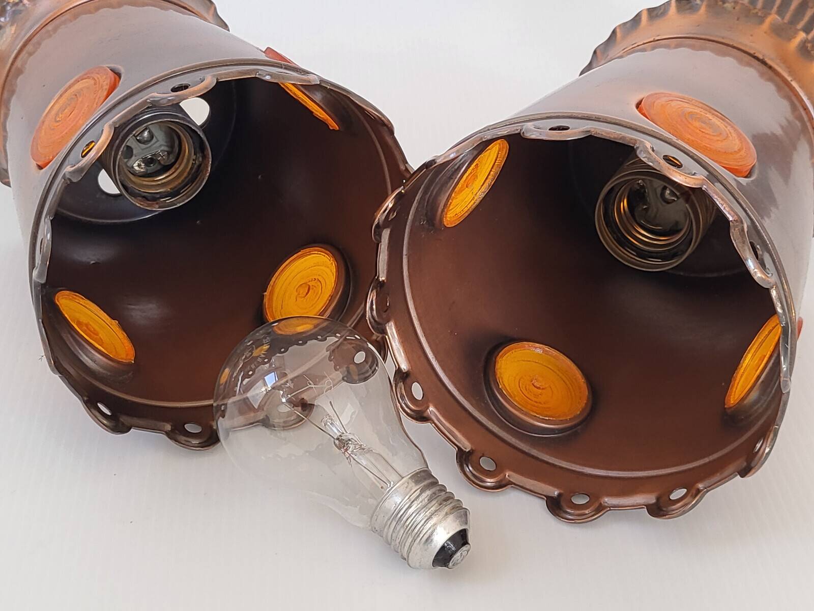 Pair of vintage 1970s brutalist suspensions in copper & orange plastic