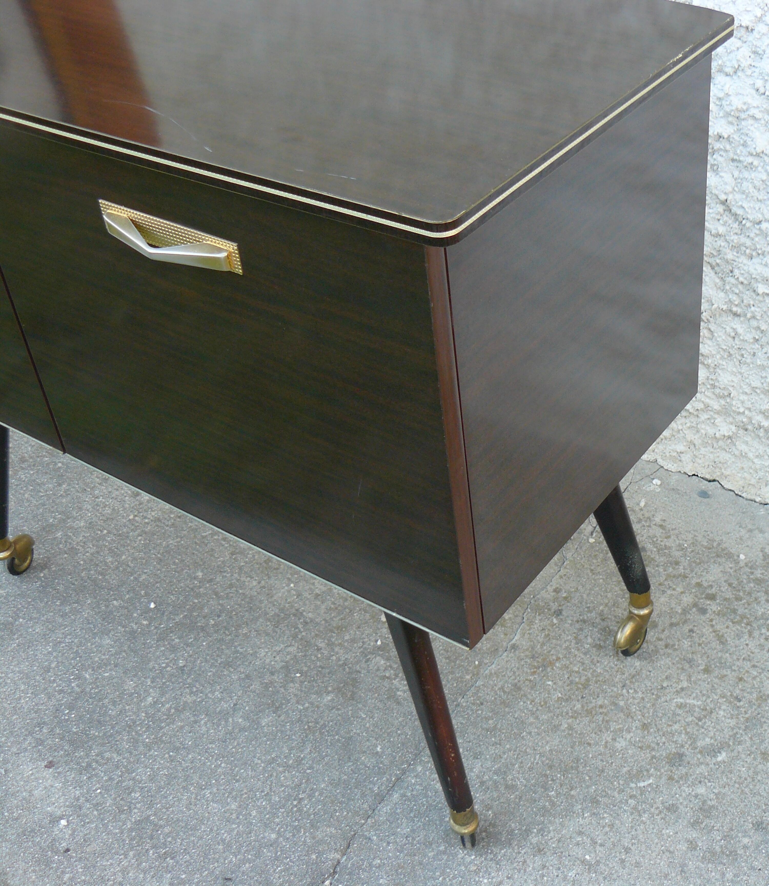 Vintage 1960s rolling and lighting bar with compass legs