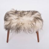Danish Mid-century Modern stool reupholstered in white and black sheep skin