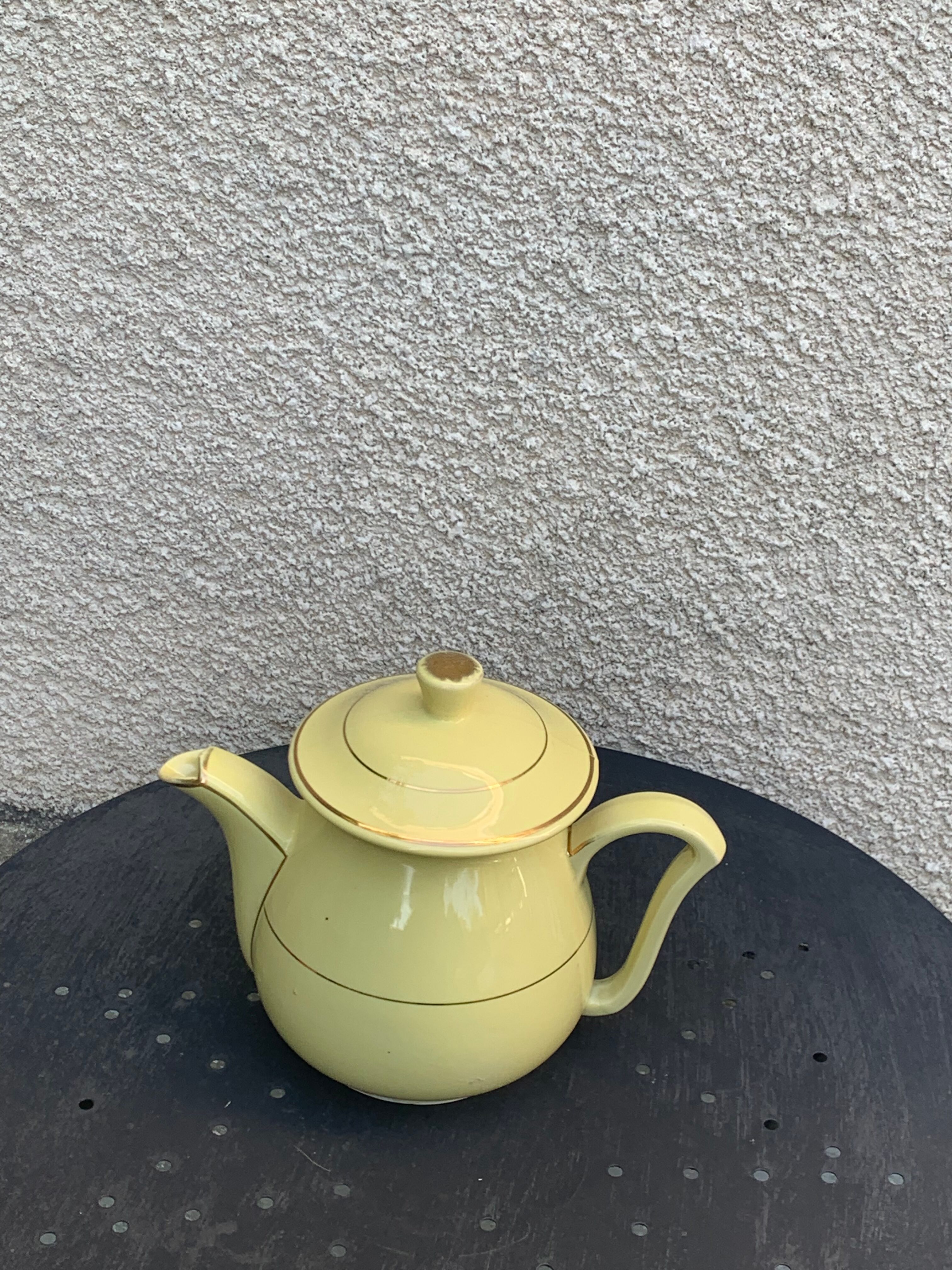 Teapot, yellow earthenware coffee maker and vintage gold edging