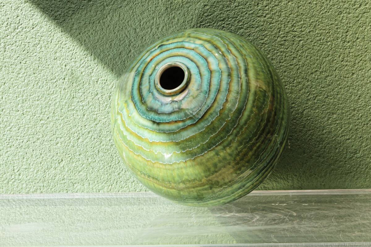Glazed ceramic ball lamp base, green gradients.