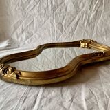 Large rococo mirror in gilded wood