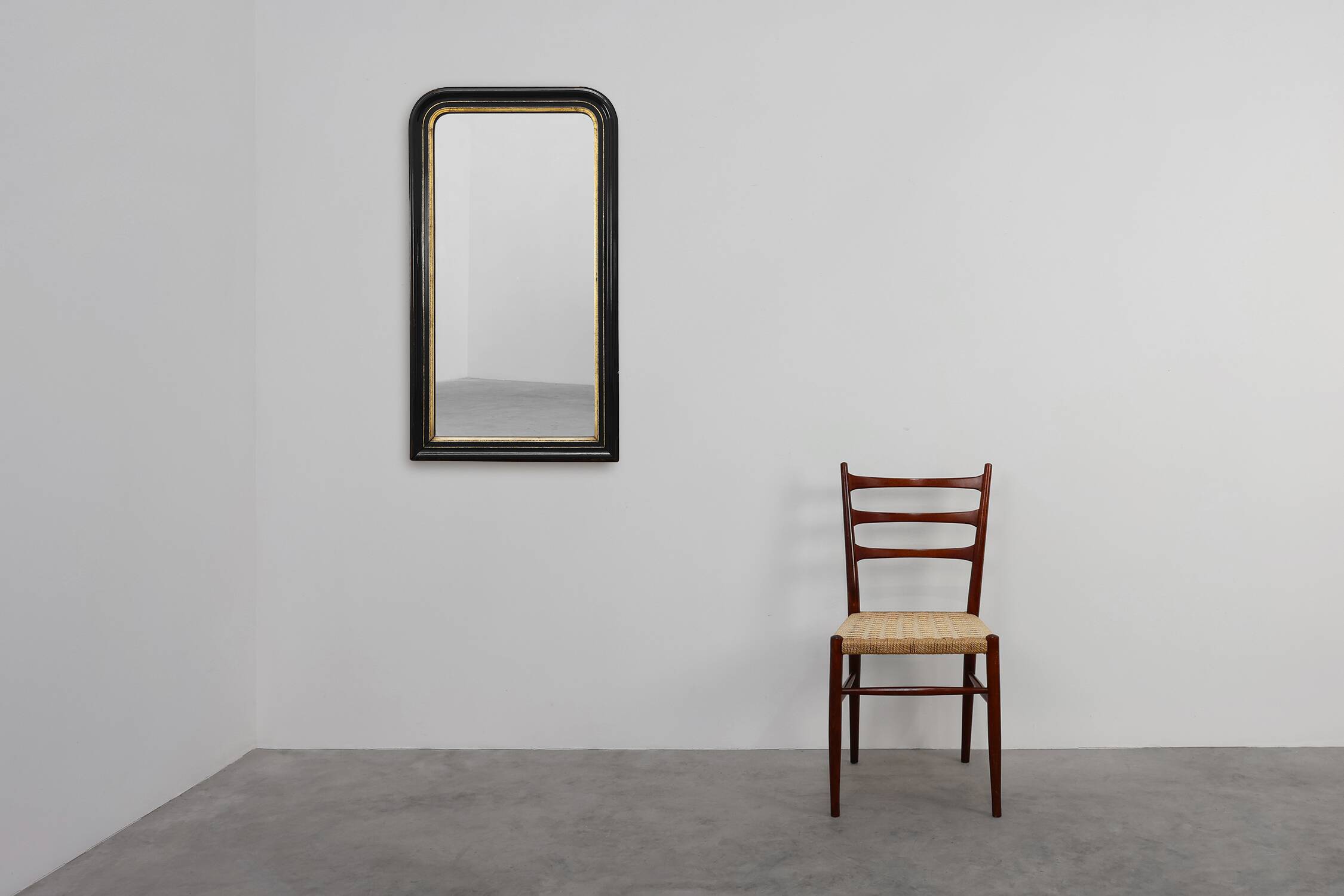 Black laquered and gilted wooden Louis Philippe mirror, France ca. 1850