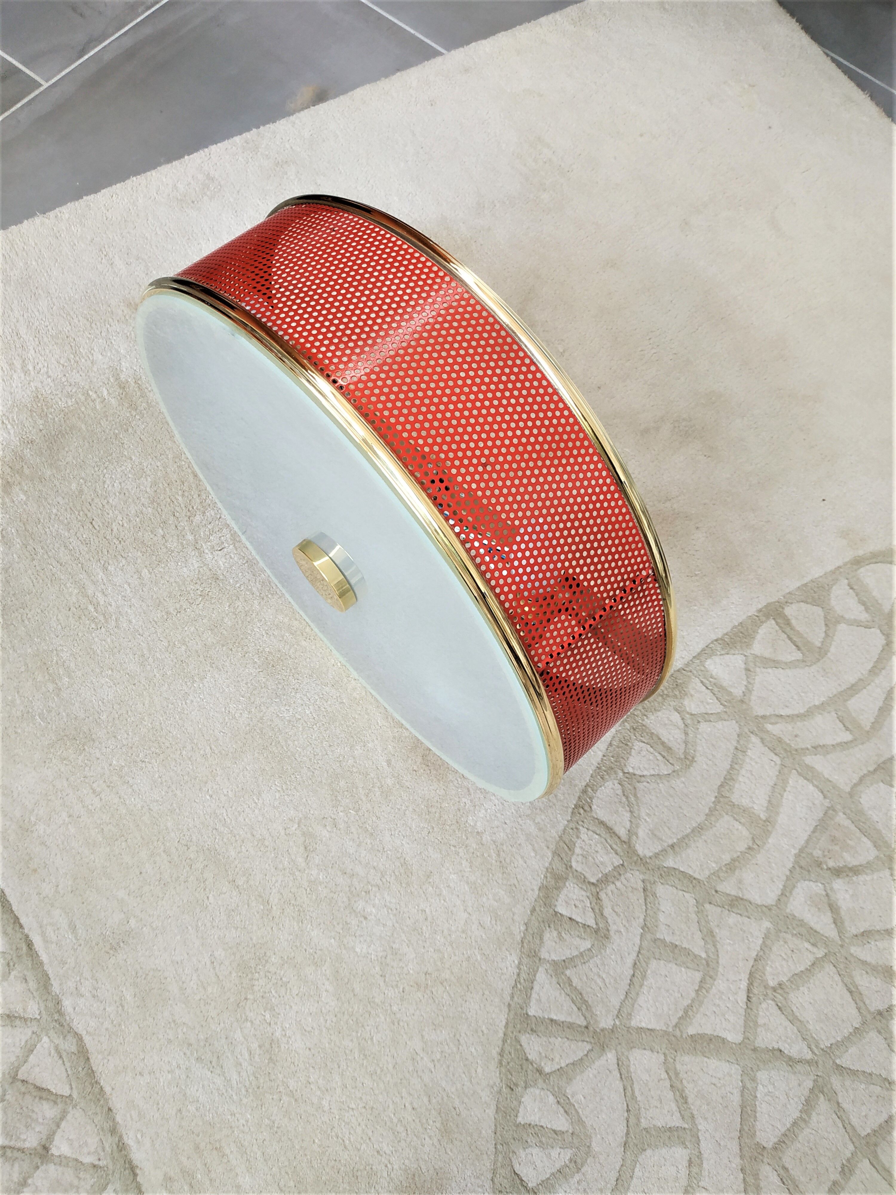 Ceiling lamp applied in red lacquered perforated metal