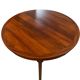 Round dining table in rosewood.