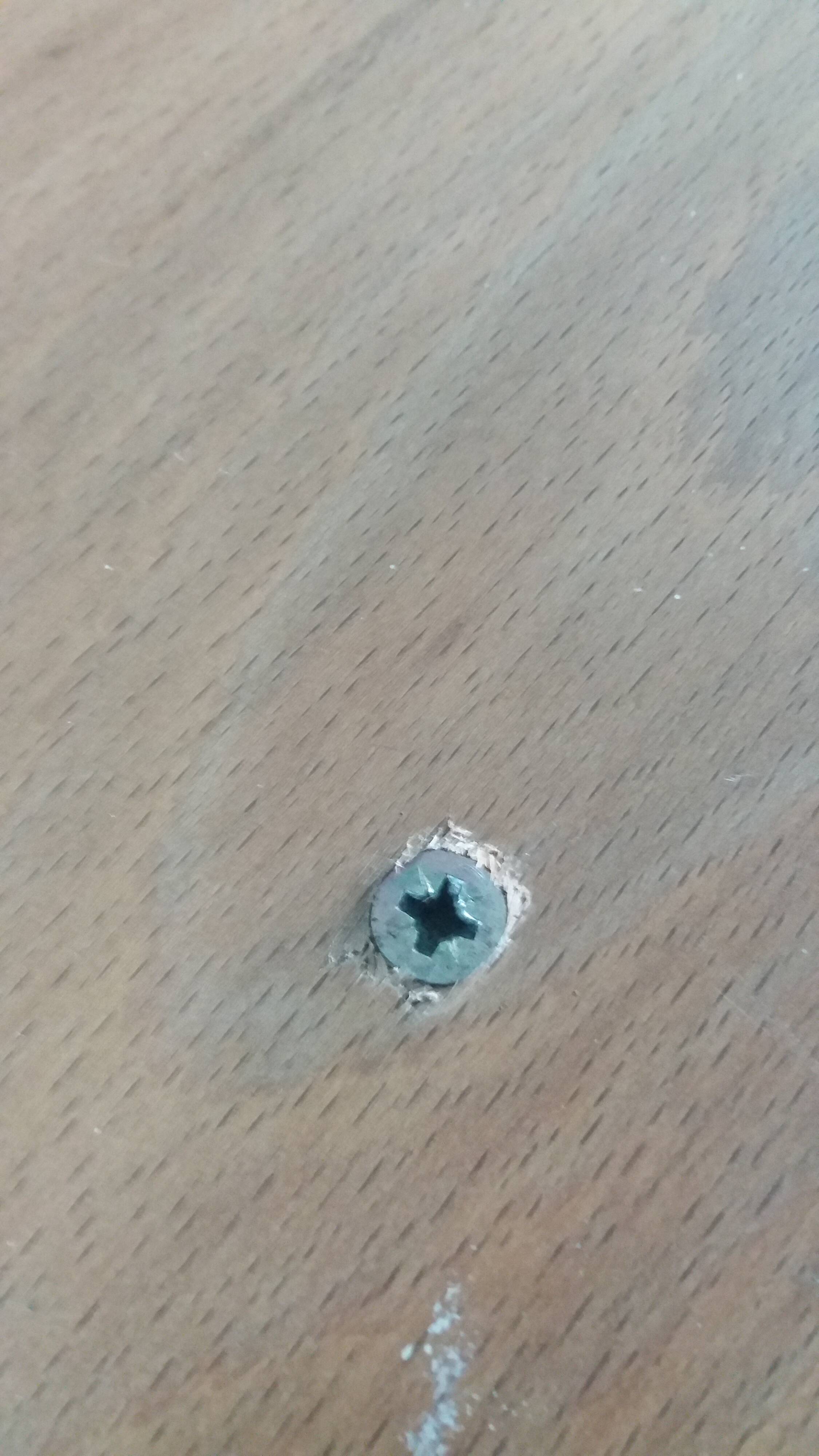 Tripod stool with a screw.