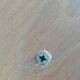 Tripod stool with a screw.