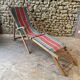 Red and green striped wooden deckchair