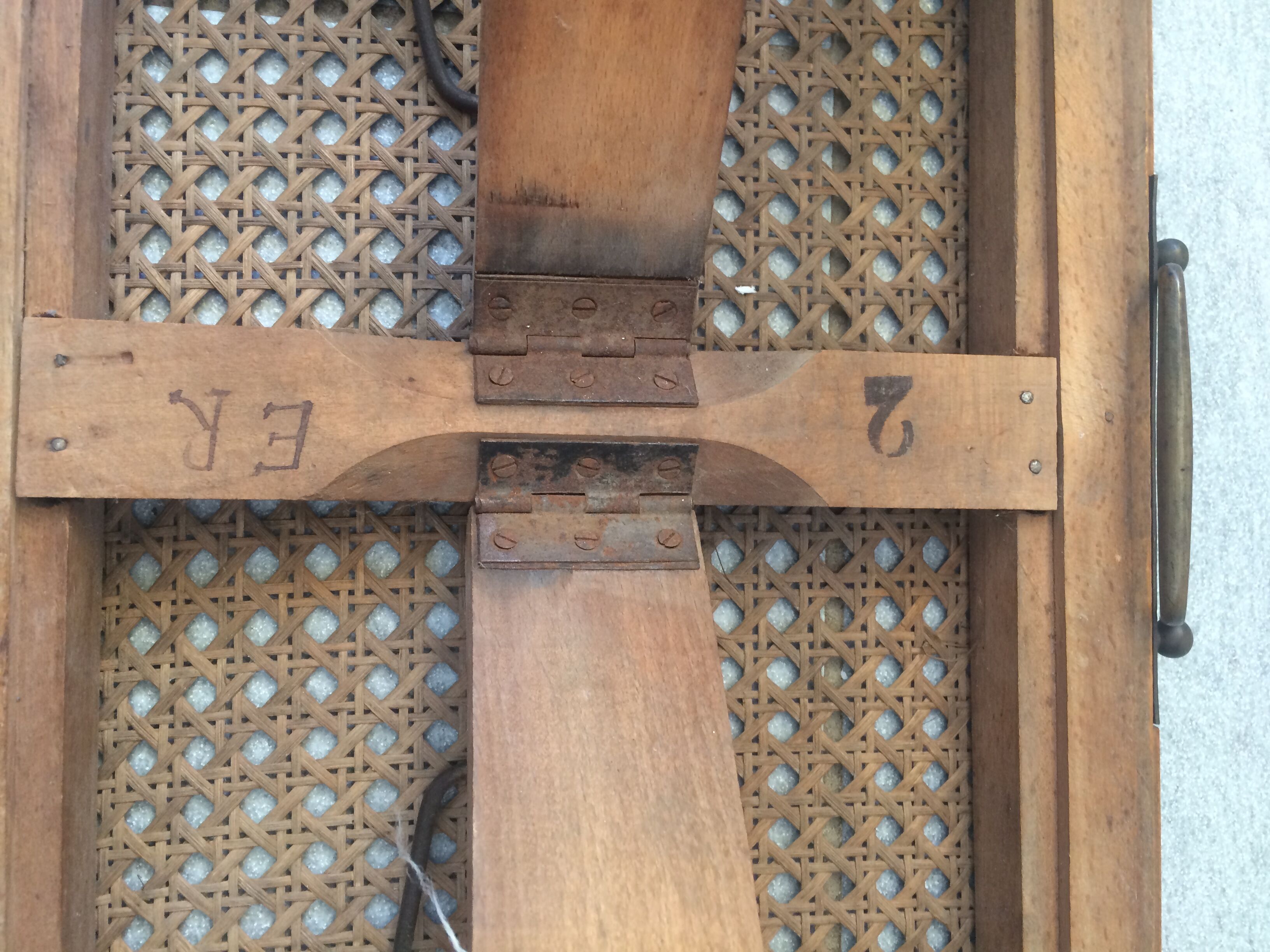 Folding stool in old caning