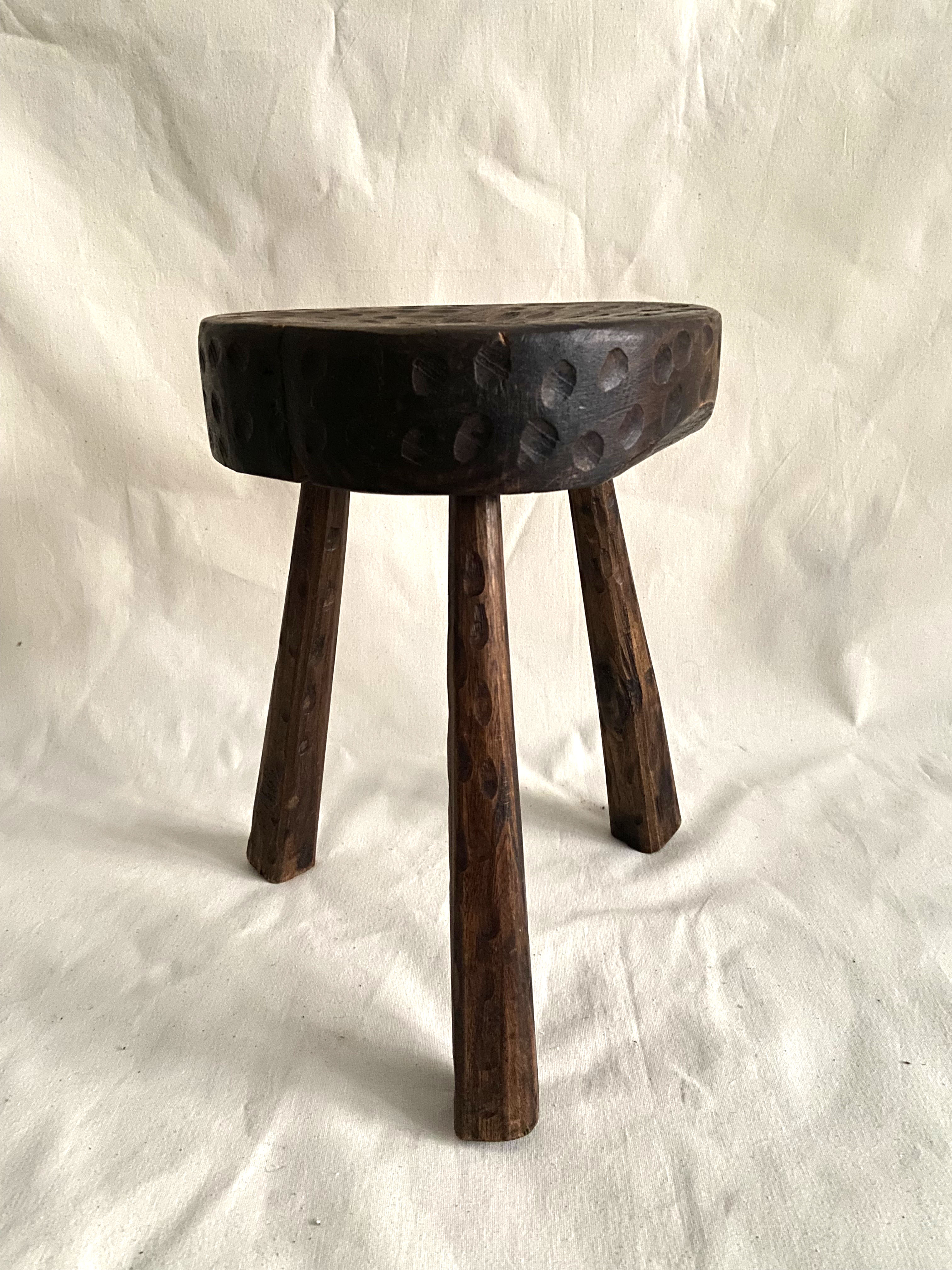 Brutalist tipode stool in carved wood