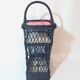Mini bar or portable bottle holder in black rattan