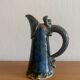 Antique Art Nouveau enamelled stoneware carafe