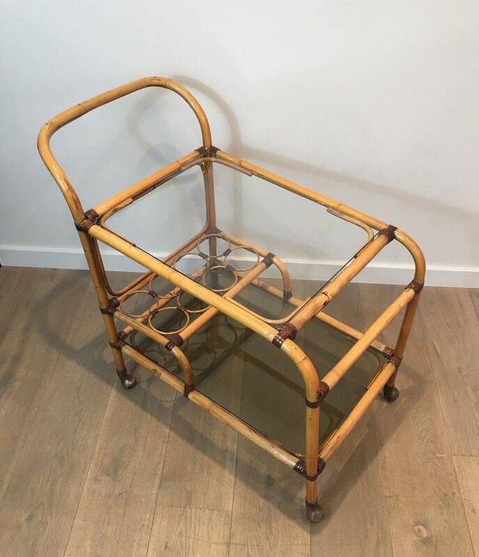 Rolling table made of rattan and leather straps