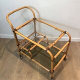 Rolling table made of rattan and leather straps