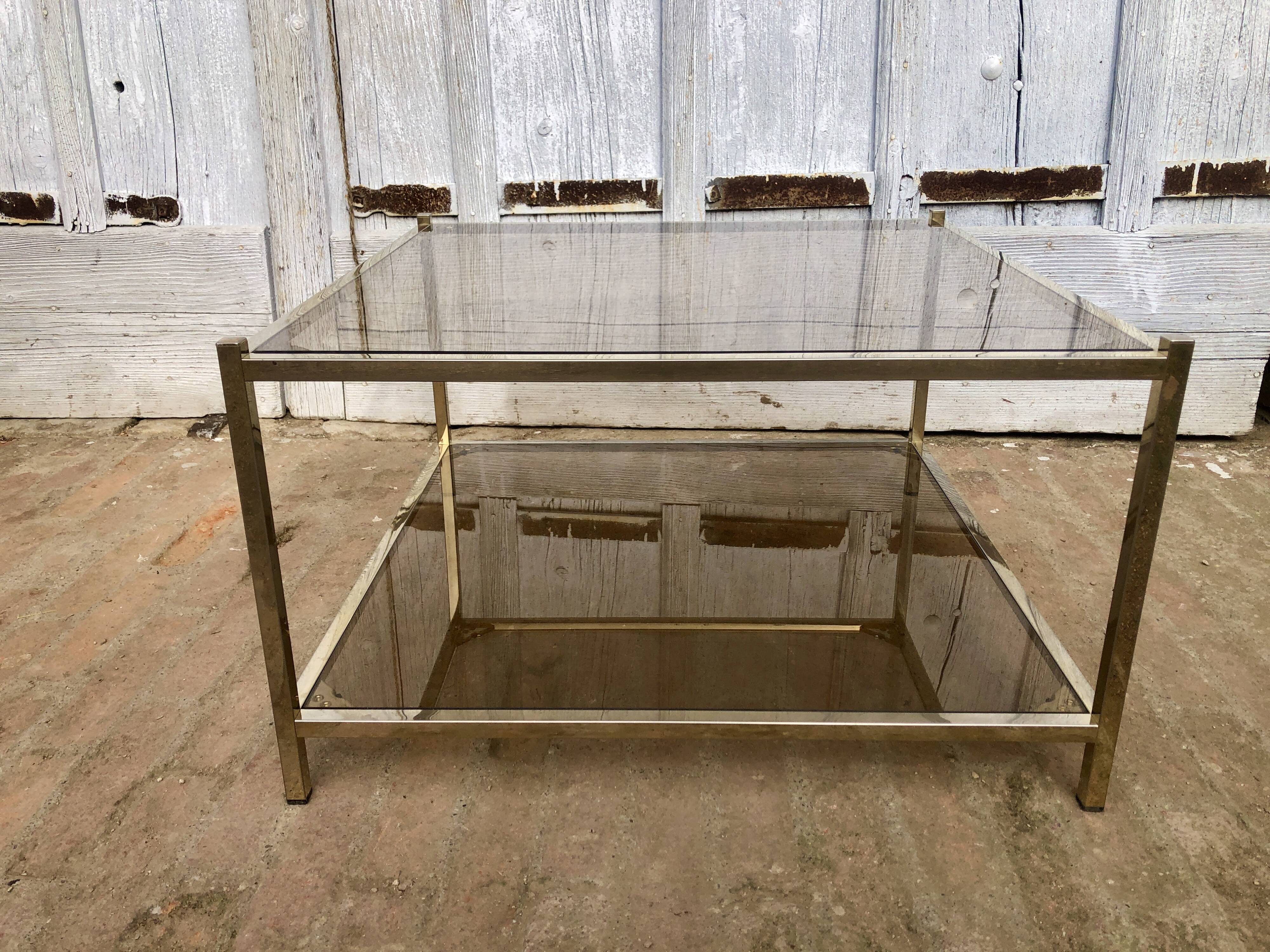 Square brass coffee table and smoked glasses