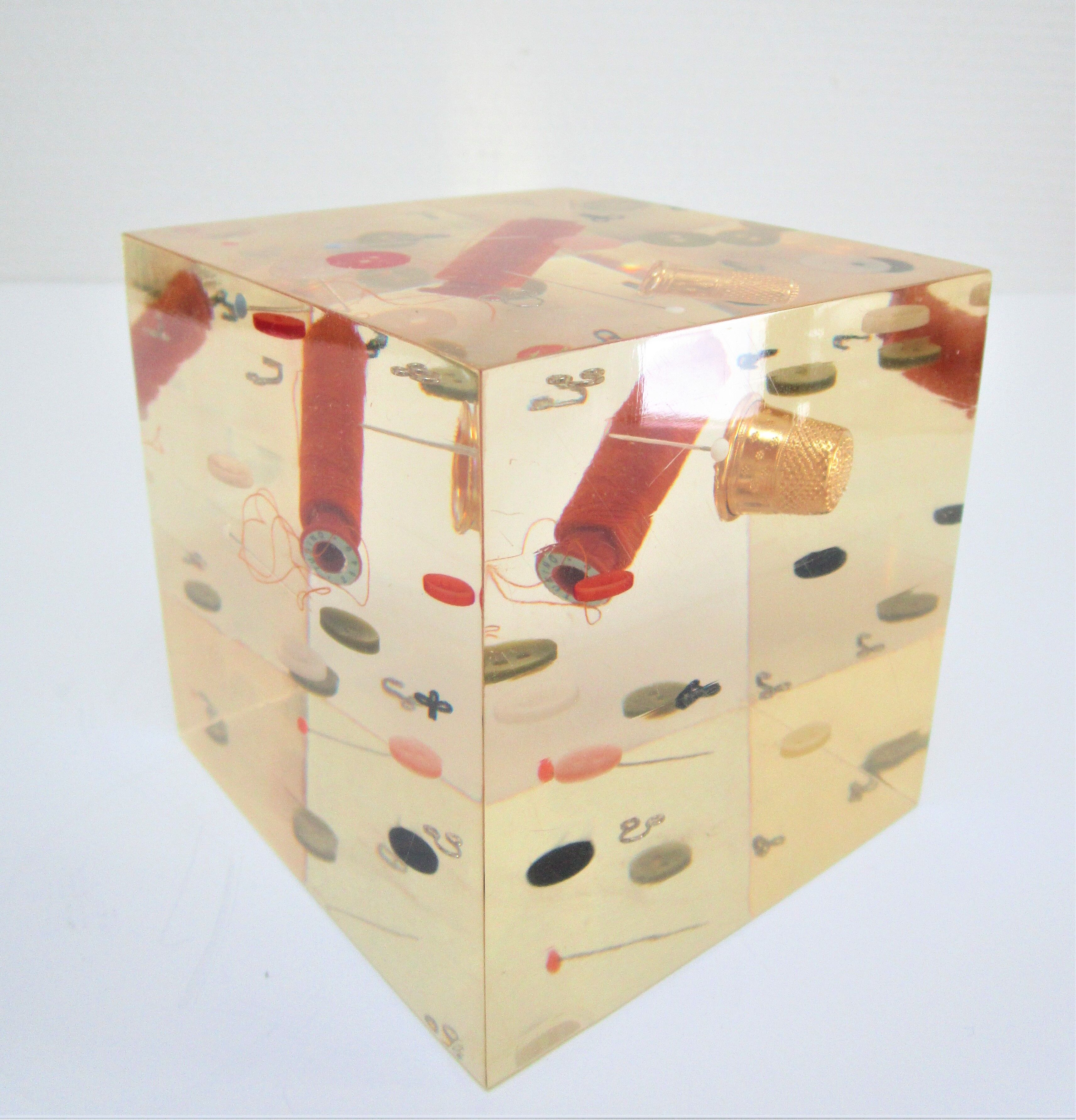 Paperweight sculpture block resin inclusions sewing design 70s