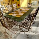 Dining table and seats for exterior or interior in metal and enameled lava tiles