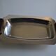 Art Deco serving dish in chrome metal with ebony handles.
