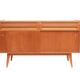 1950s cherry wood sideboard with sliding doors.