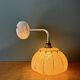 Vintage glass wall light with a pink and gold Clichy globe.