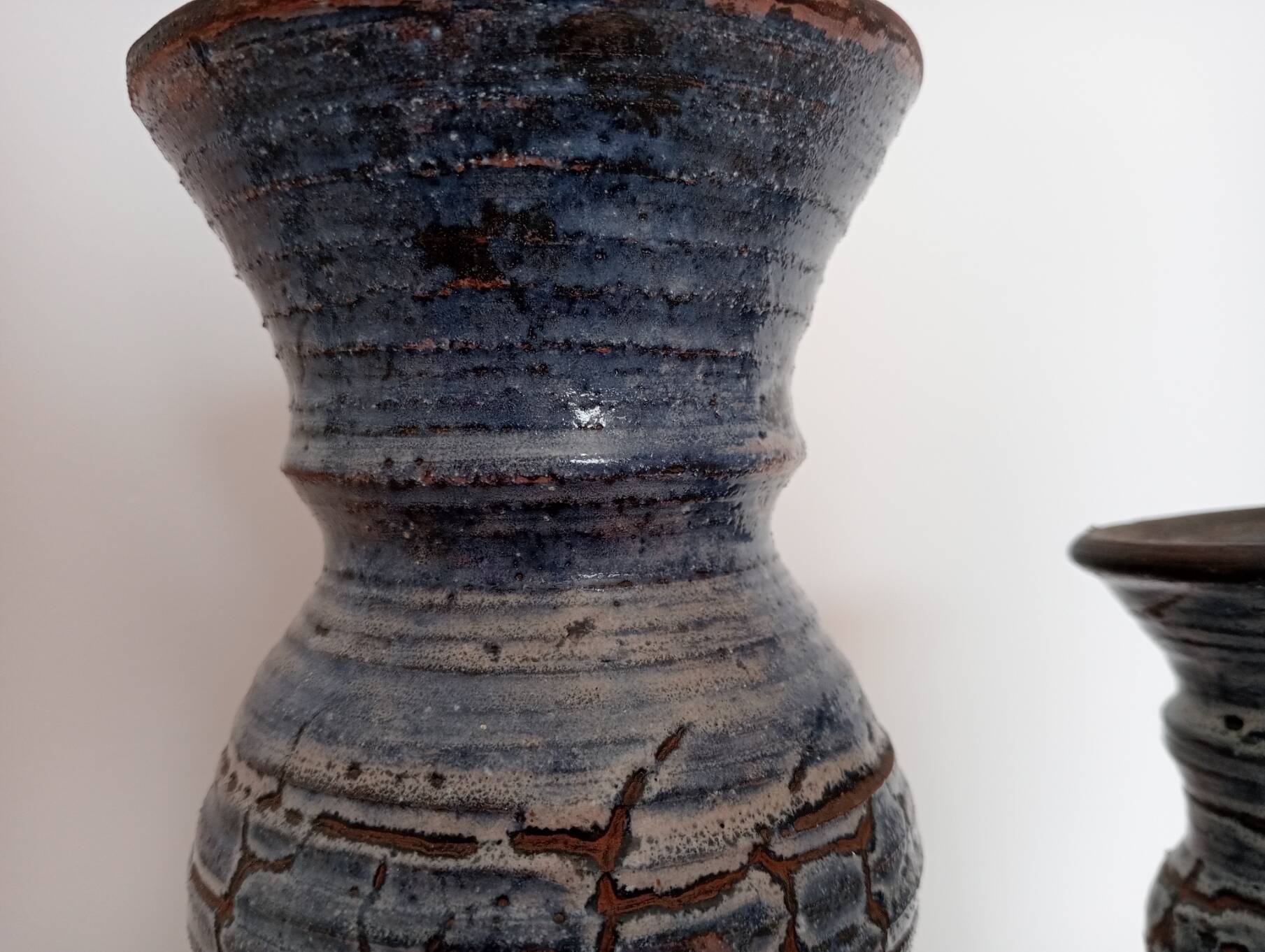 Blue glazed terracotta vase and candle holder