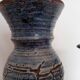 Vase et bougeoir bleus en terre cuite émaillée